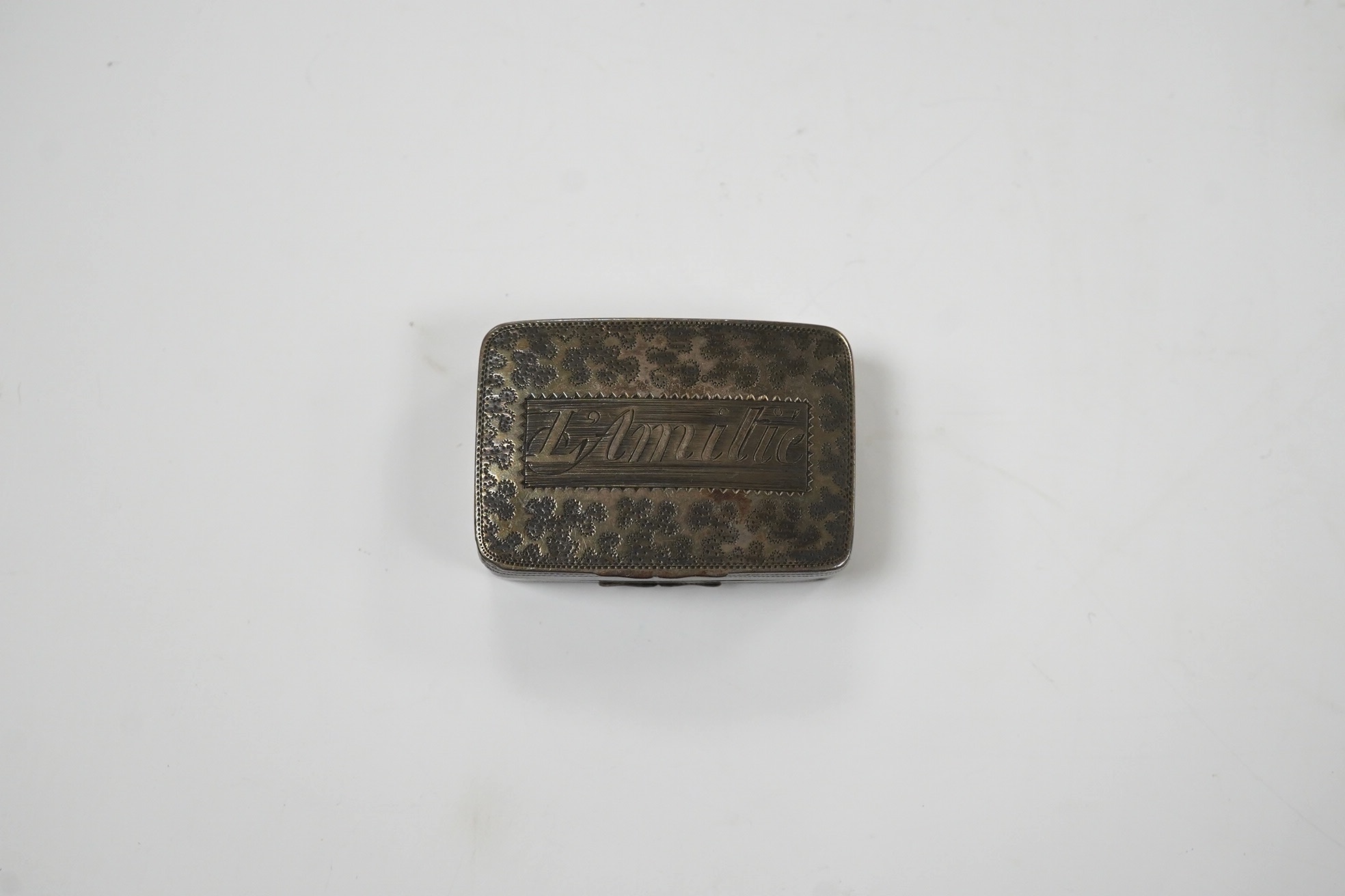 A George III silver concave vinaigrette, by Joseph Wilmore, Birmingham, 1812, 34mm, engraved 'L'Amitie'. Condition - poor to fair